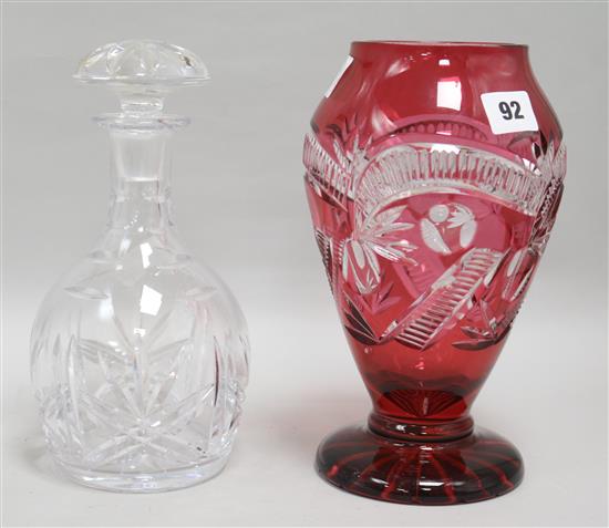 A ruby cut glass vase and a decanter